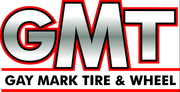 Logo for Gay Mark Tire & Wheel, with silver letters GMT outlined in red, and the company name below in black text.