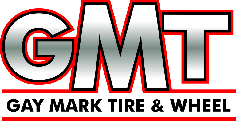 Logo for Gay Mark Tire & Wheel, with silver letters GMT outlined in red, and the company name below in black text.