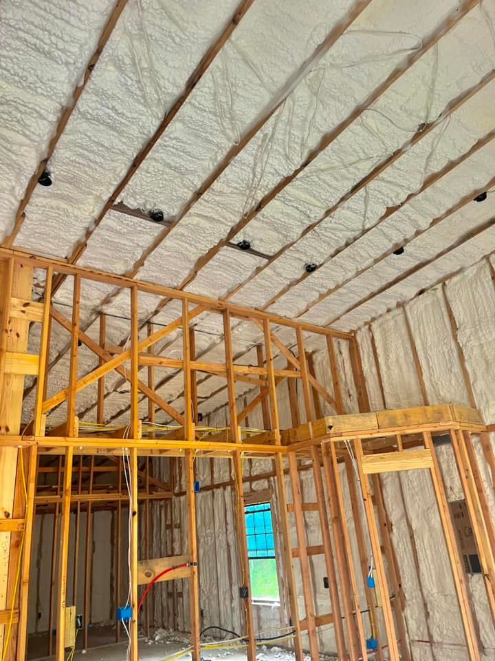 A house is being built with a lot of insulation on the ceiling.