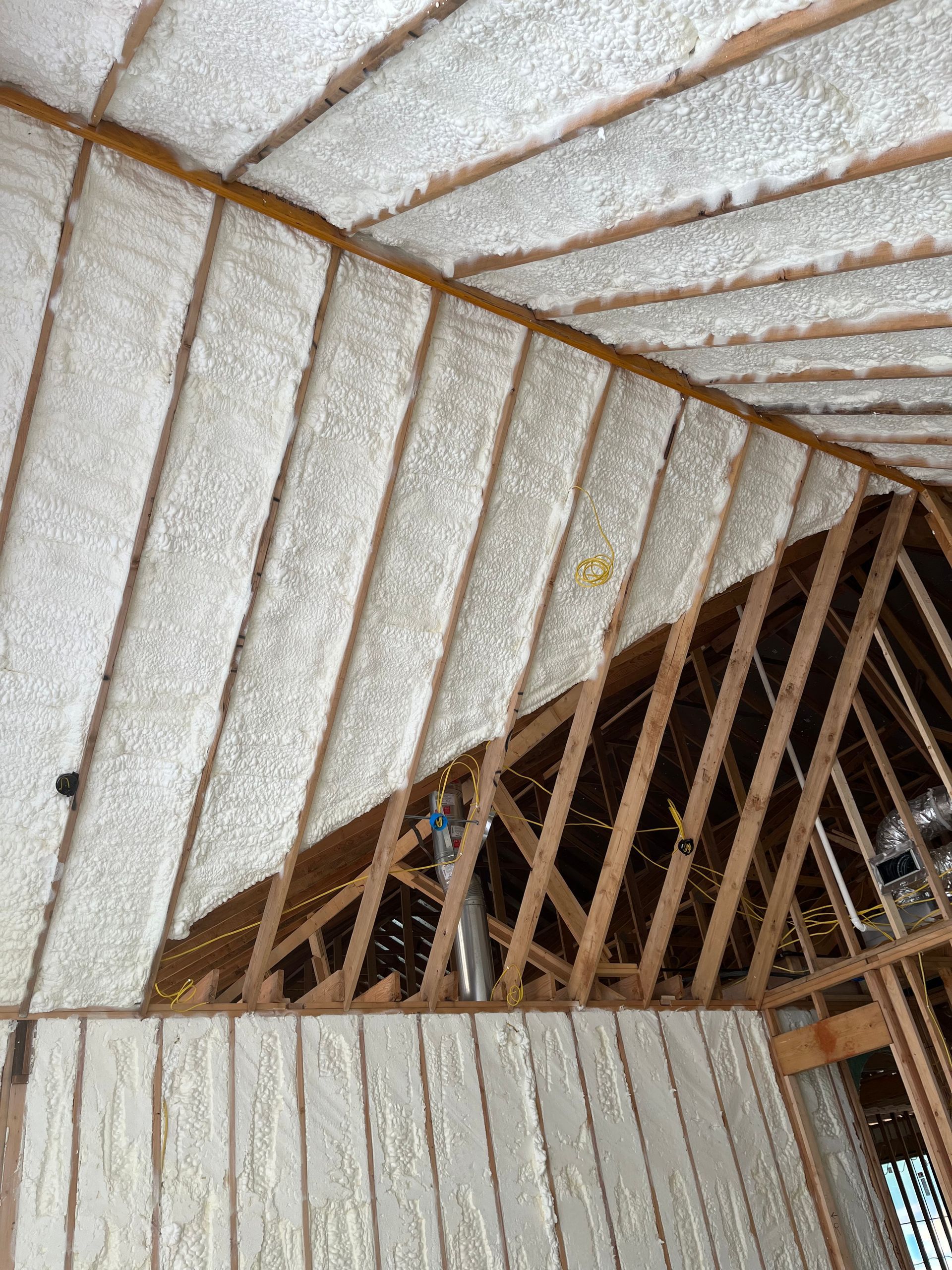 The ceiling of a building under construction is covered in foam.