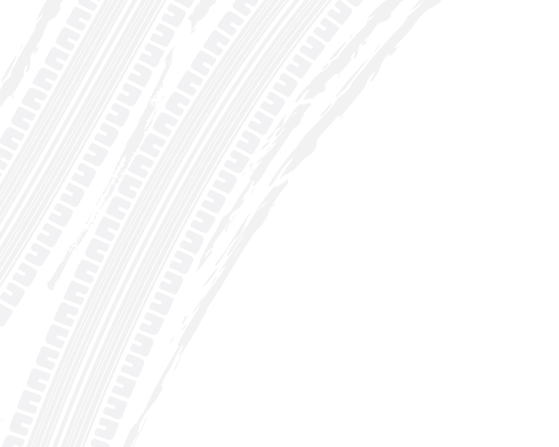 Two white tire tracks diagonally across a white background. | Doran-King Garage Inc
