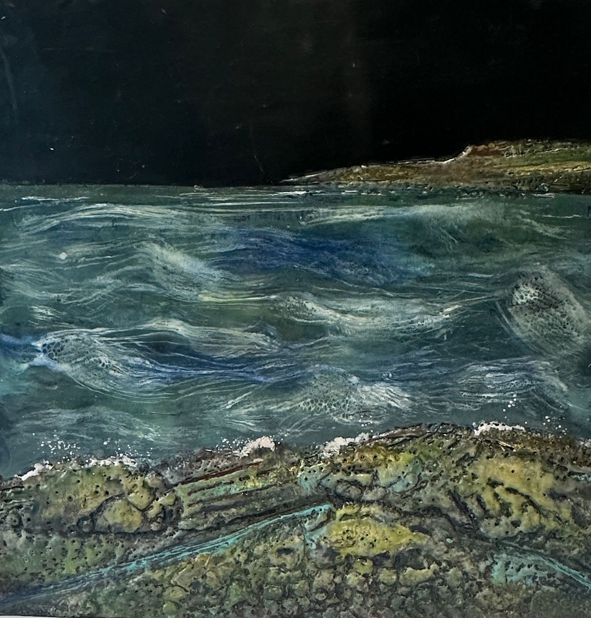 A painting of a body of water with rocks in the foreground