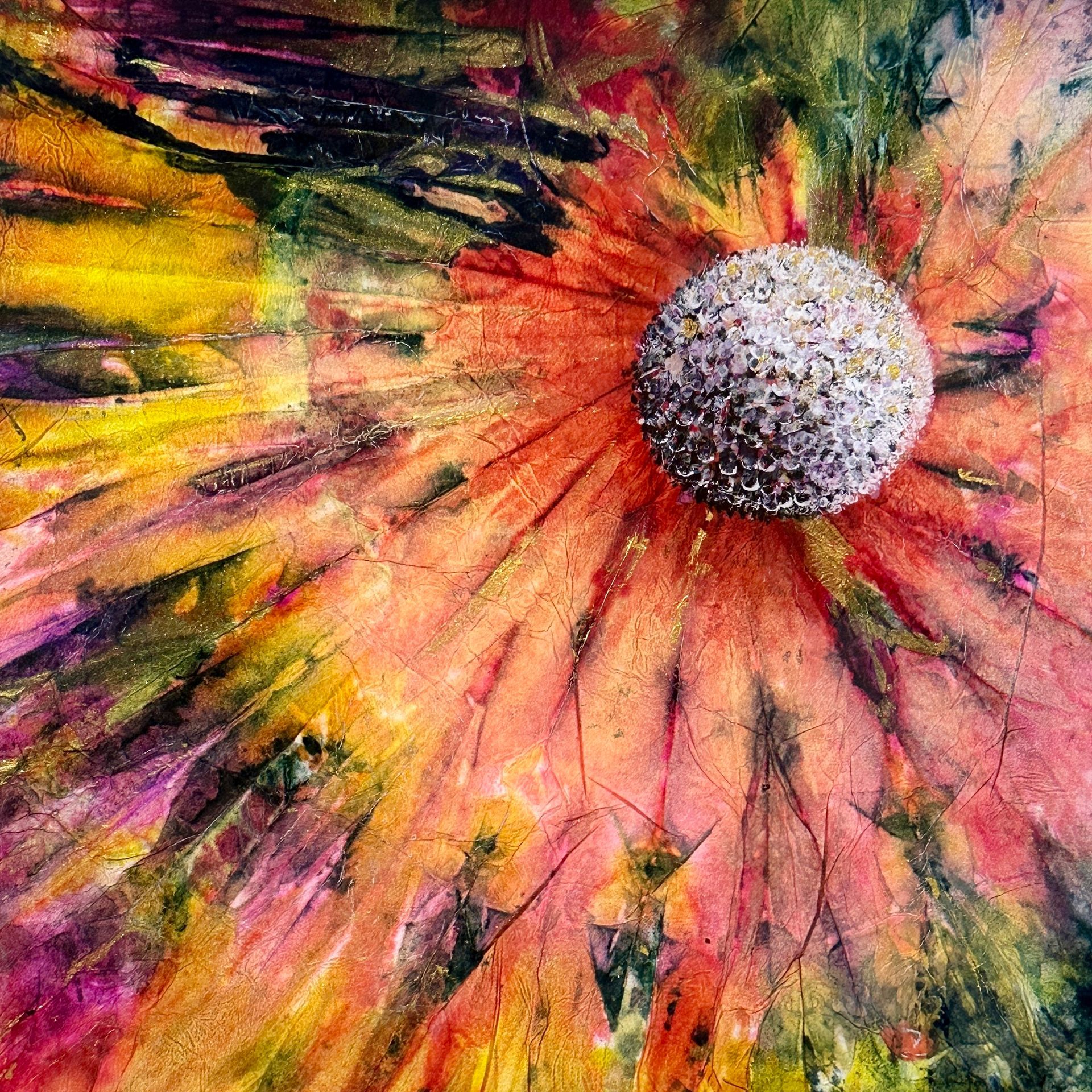 A colorful painting of a flower with a white center