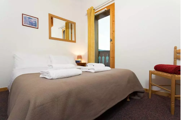An image of one of the bedrooms in one the chalets at Les Chalet des Alpages