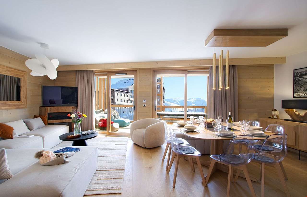 An image of one of the apartments at Prestige residence Phoenix A, with a living area with sofas, dining area and a terrace