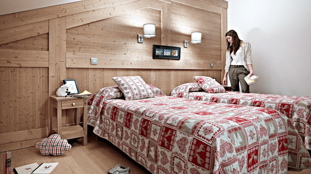 An image of a double bed in a luxurious looking bedroom at Le Ruitor