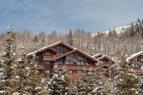 A large building in the middle of a snowy forest