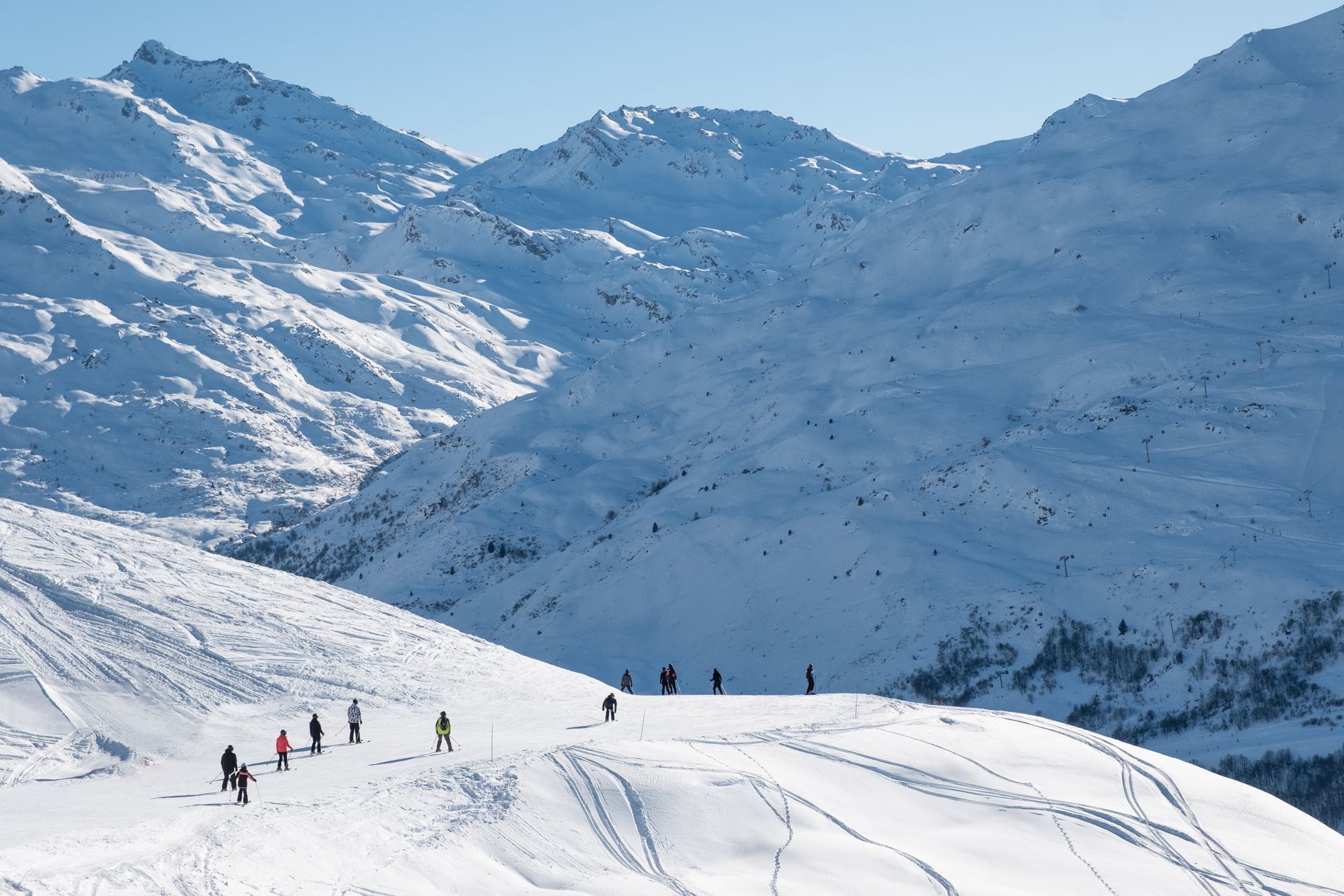 An image of skiers skiing through the 3 Valleys