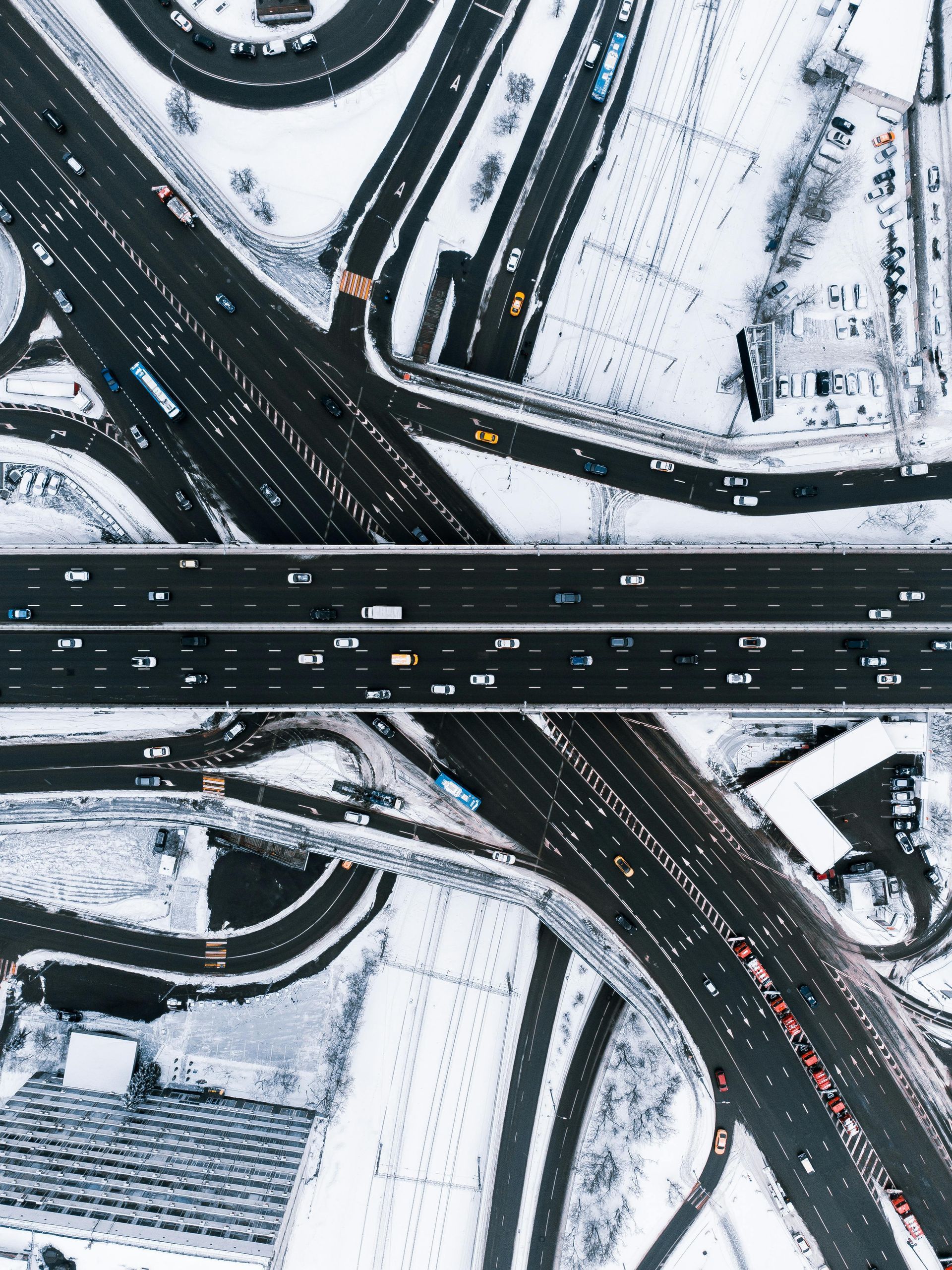 An image of crossing roads surrounded by snow