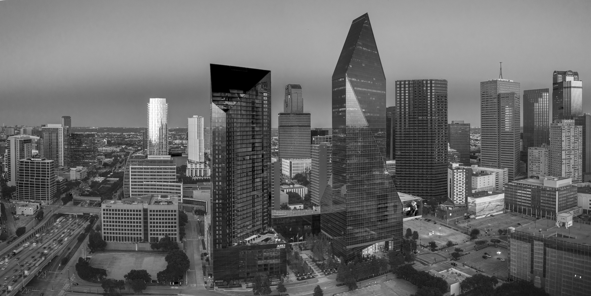 A black and white photo of a city skyline at night