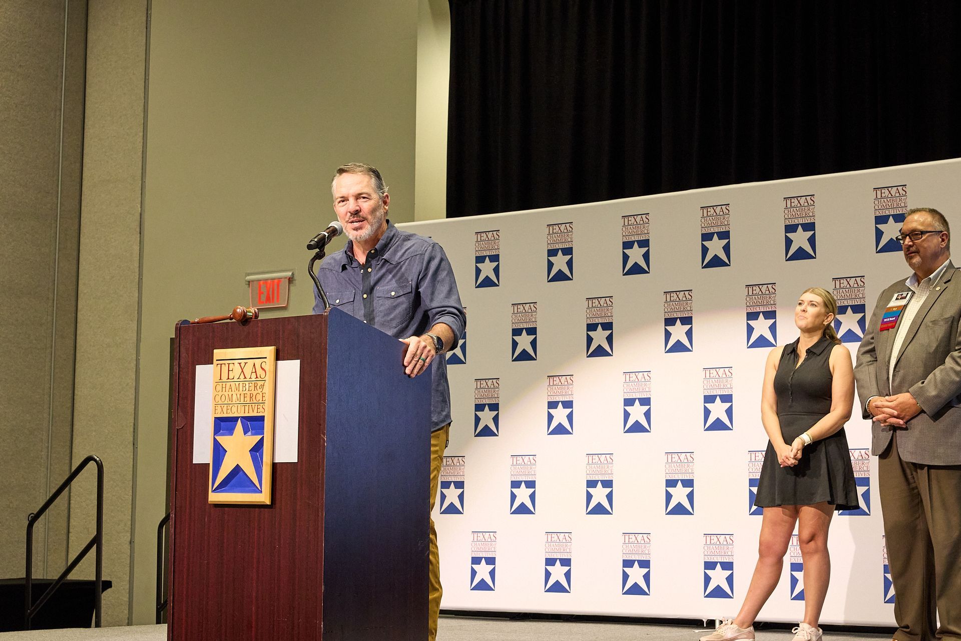 A man stands at a podium giving a speech
