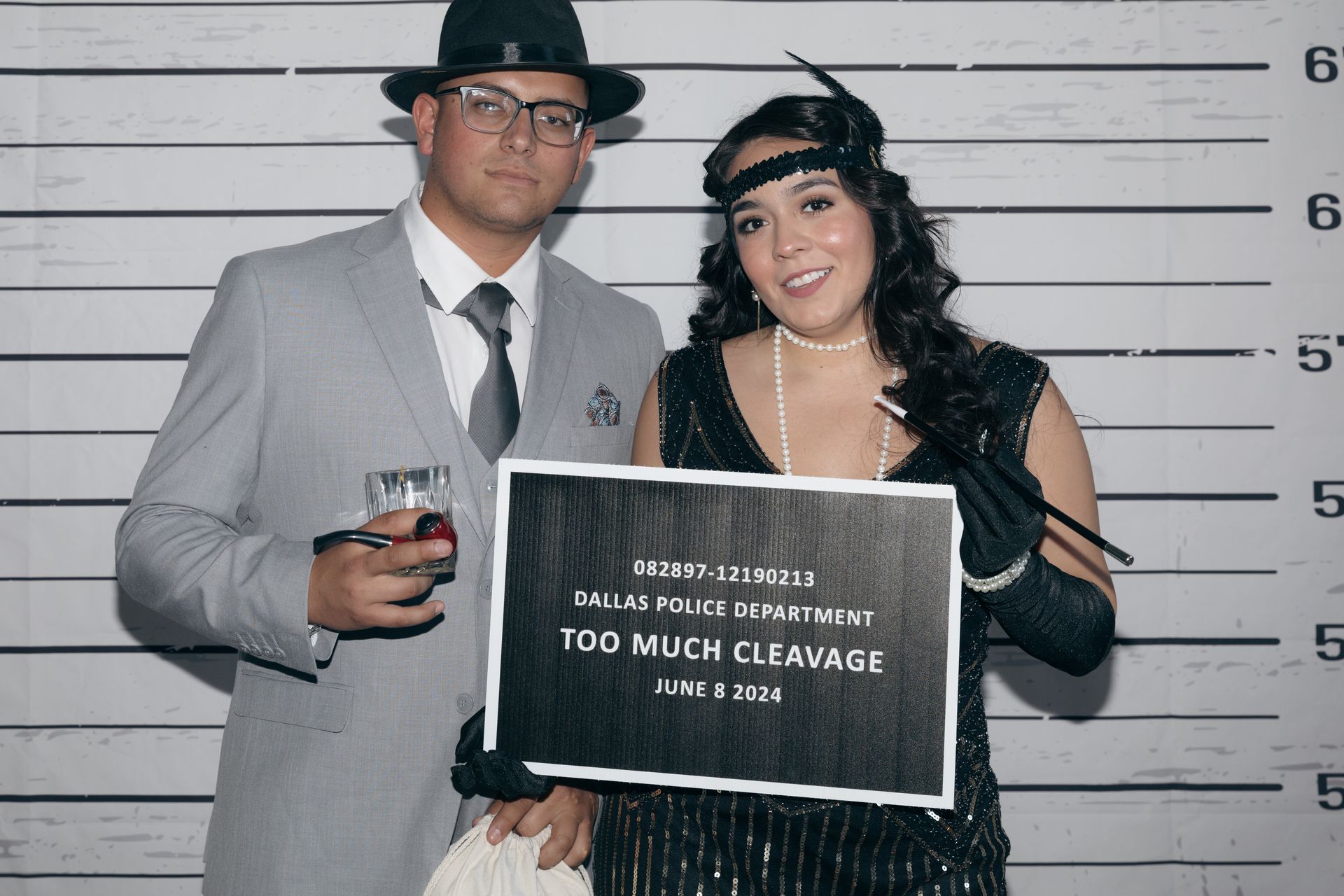 A man and a woman are casually posing for a picture in front of a police lineup.