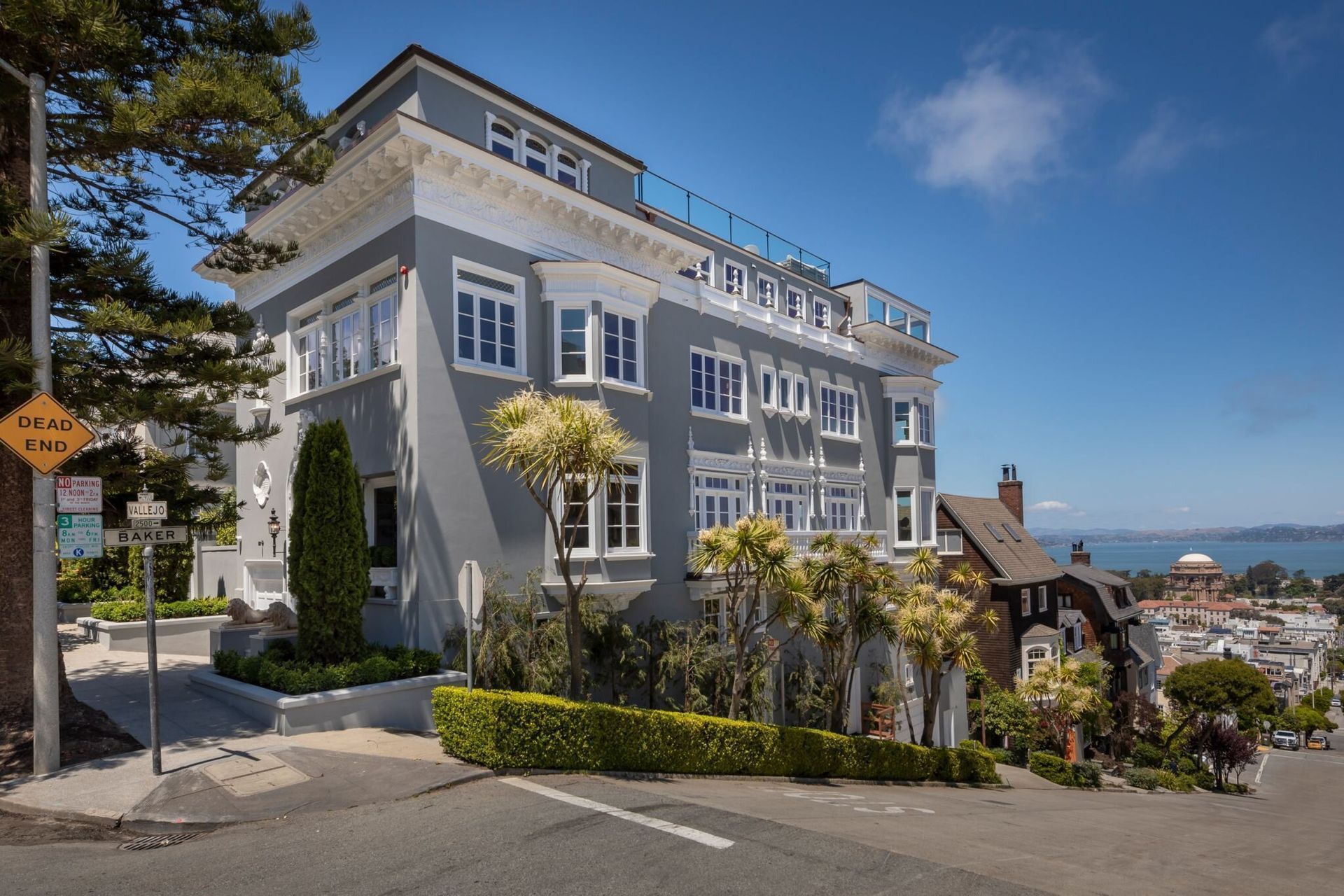 A large building with a lot of windows is sitting on top of a hill