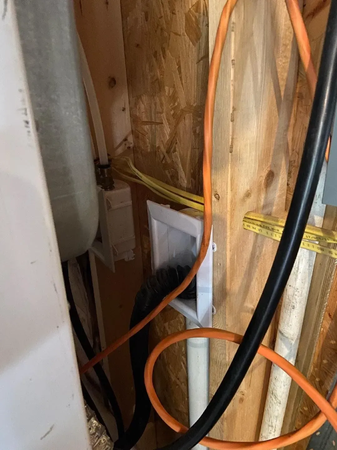 A bunch of wires are connected to a wall.