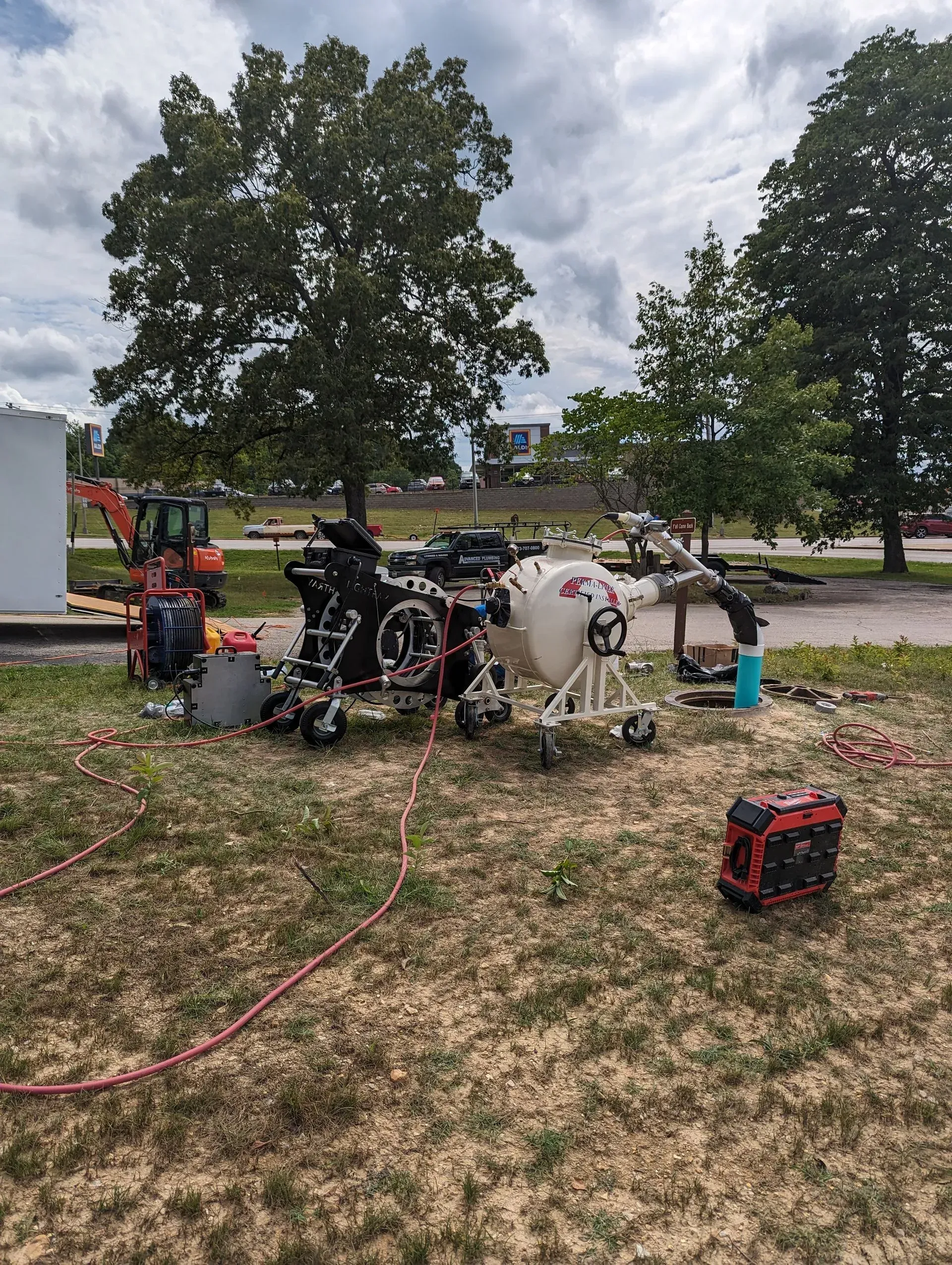 A group of machinery is sitting on top of a grass covered field.