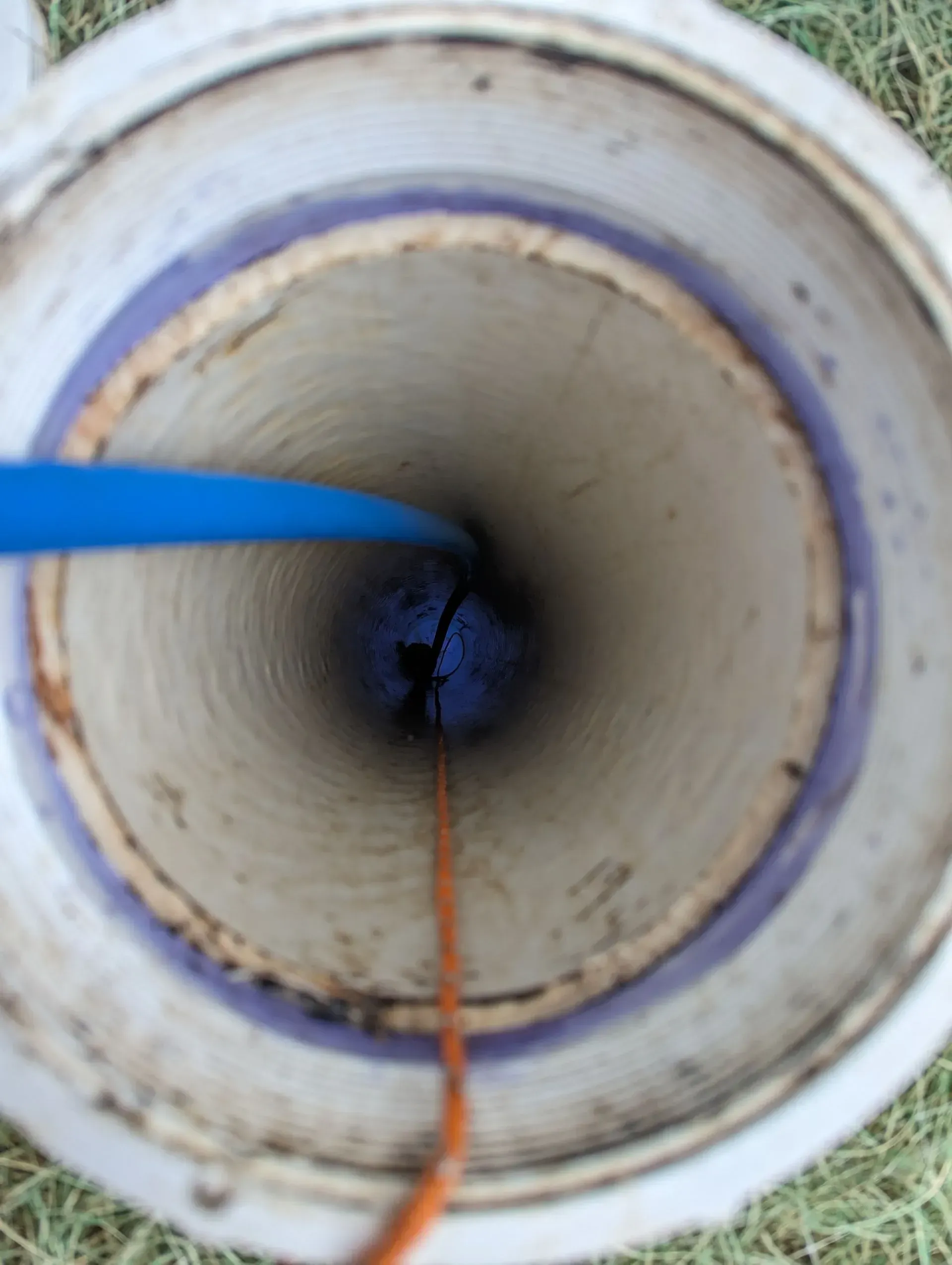 The inside of a bucket with a blue object in it