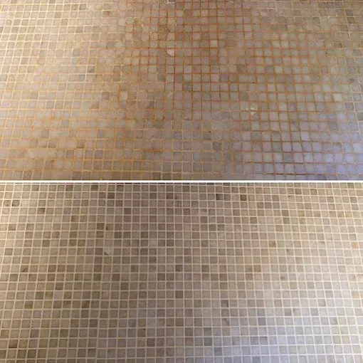 Before-and-after comparison of a tan mosaic tiled floor showing improved cleanliness in the bottom half.
