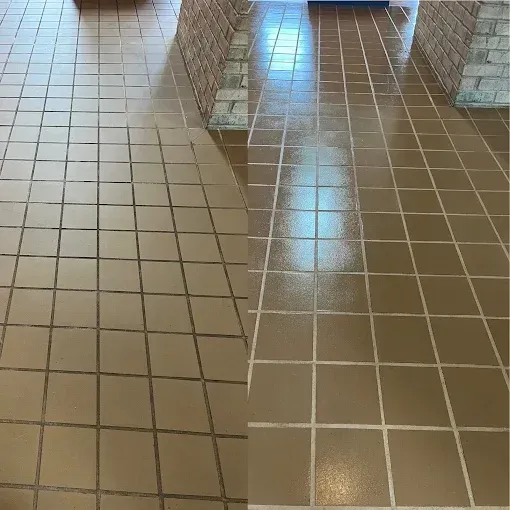 Before-and-after shot of a light brown tile floor showing deep cleaning and grout restoration between two brick pillars.
