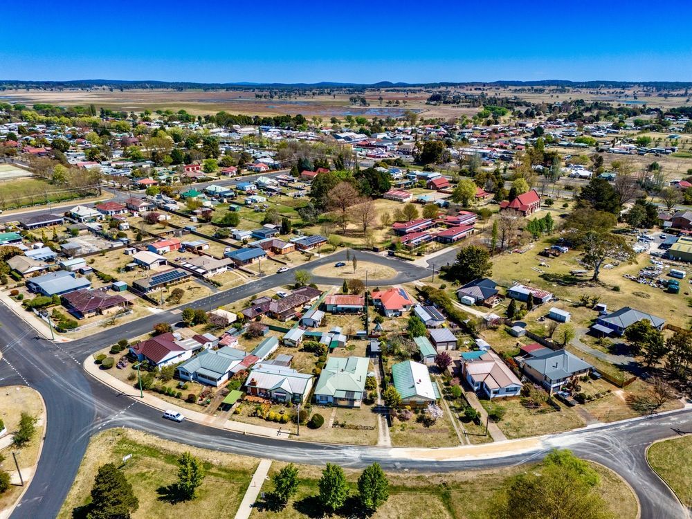 An Aerial View Of A Residential Area With Lots Of Houses And Trees — H2O Plumbing & Maintenance Services In Guyra, NSW