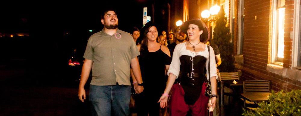 night tour of group with festively dressed tour guide