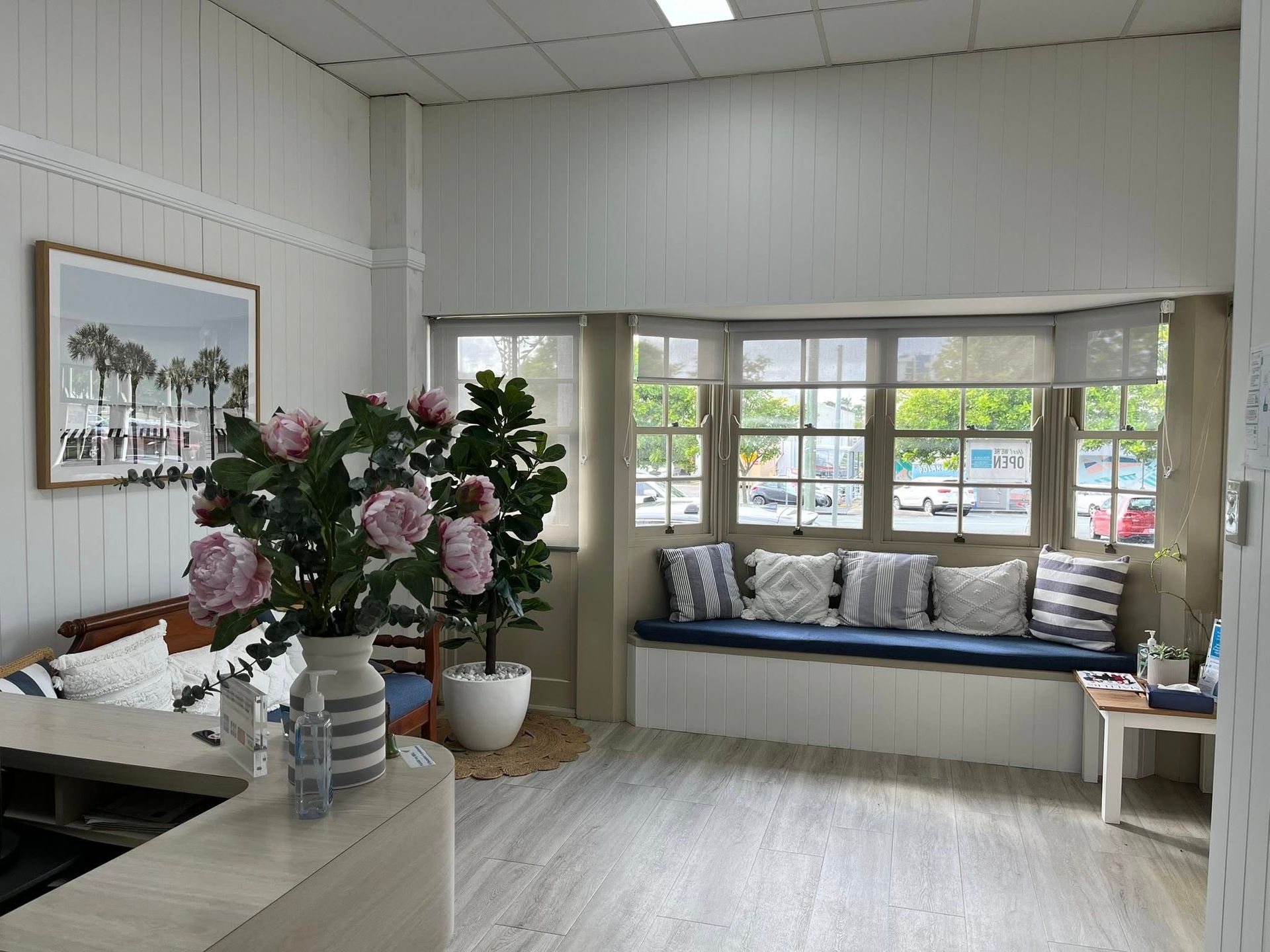 A Living Room With a Couch and a Picture on the Wall — Pollock Ingram Solicitors in Caloundra, QLD