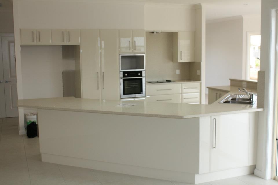 A Kitchen With White Cabinets and Stainless Steel Appliances — Moore Than Just Kitchens In Manilla, NSW