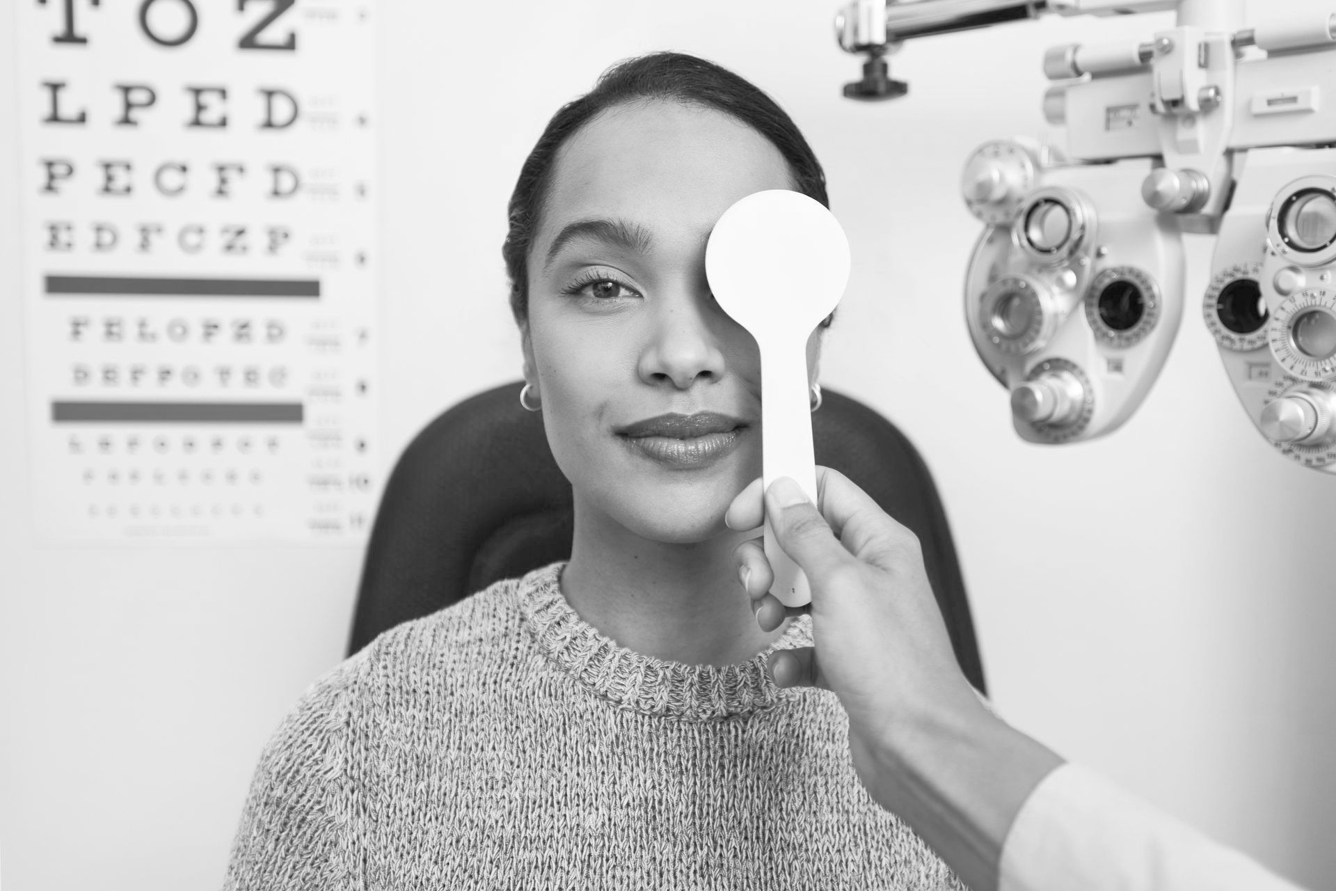 A woman is getting her eyes examined by an ophthalmologist.