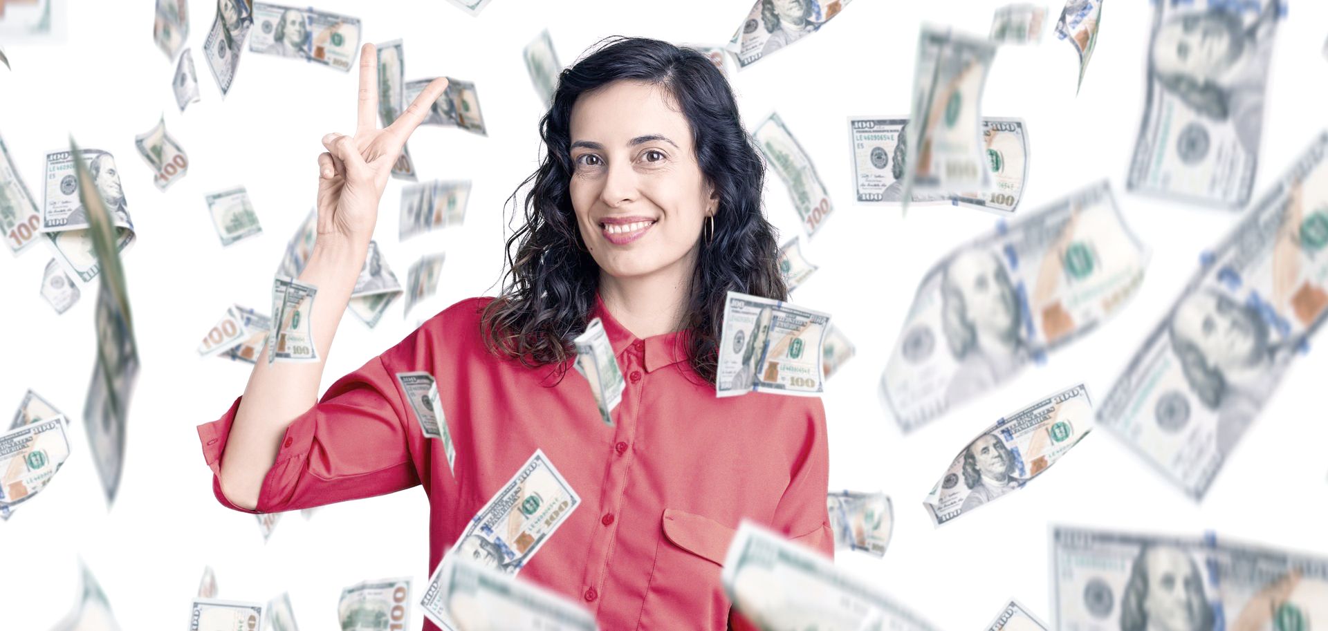 a young woman is standing in a cloud of money giving a peace sign 