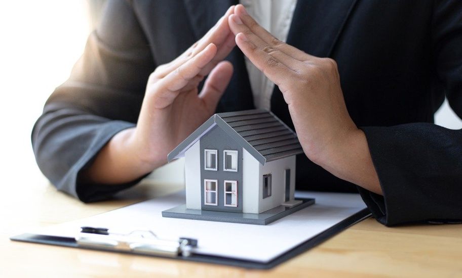 man protecting a house