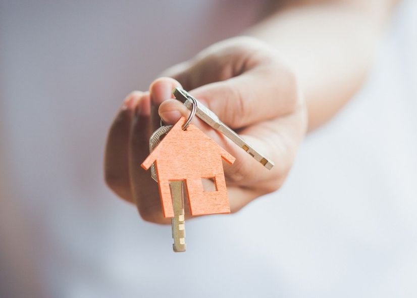agent holding house key