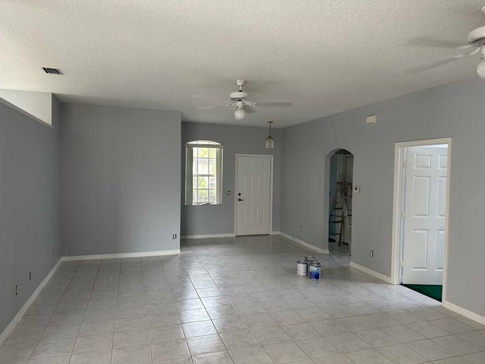 A kitchen with granite counter tops and stainless steel appliances