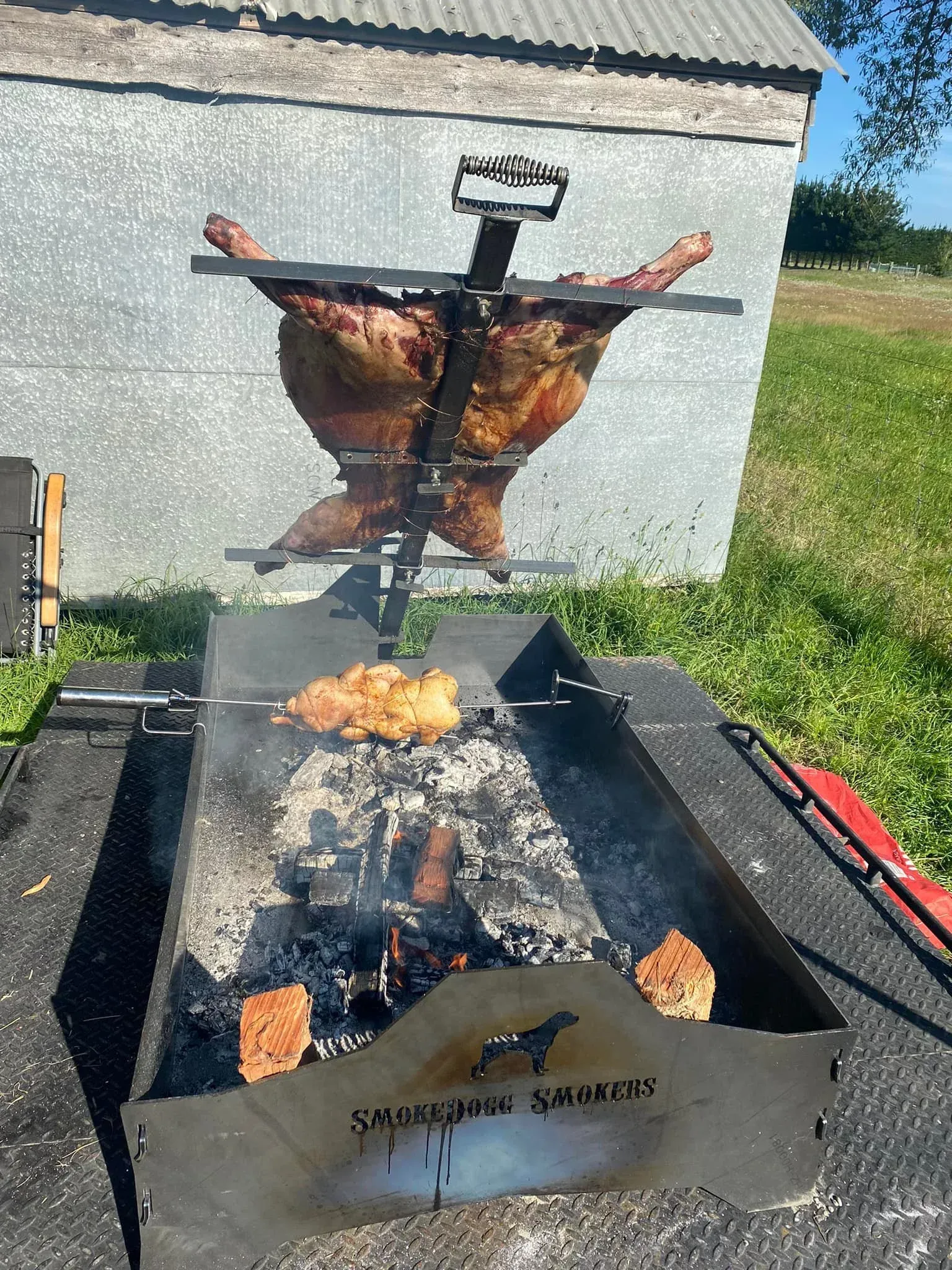 A large piece of meat is being cooked on a grill.