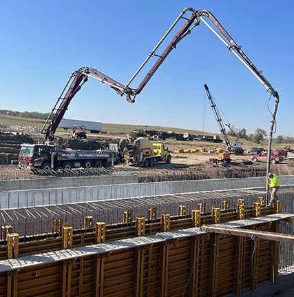 A concrete pump is being used on a construction site