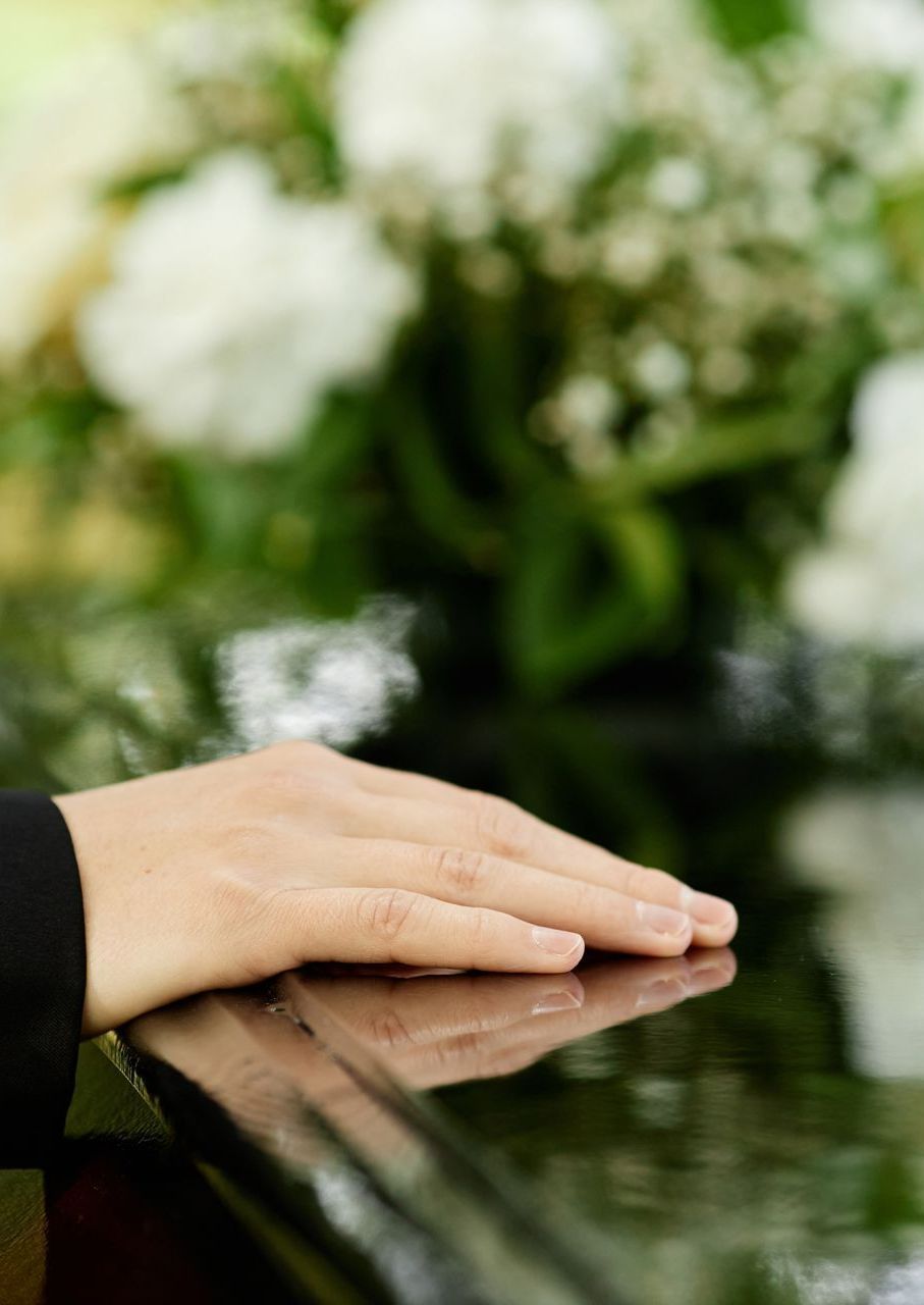 A close up of a person 's hand on a piano keyboard.