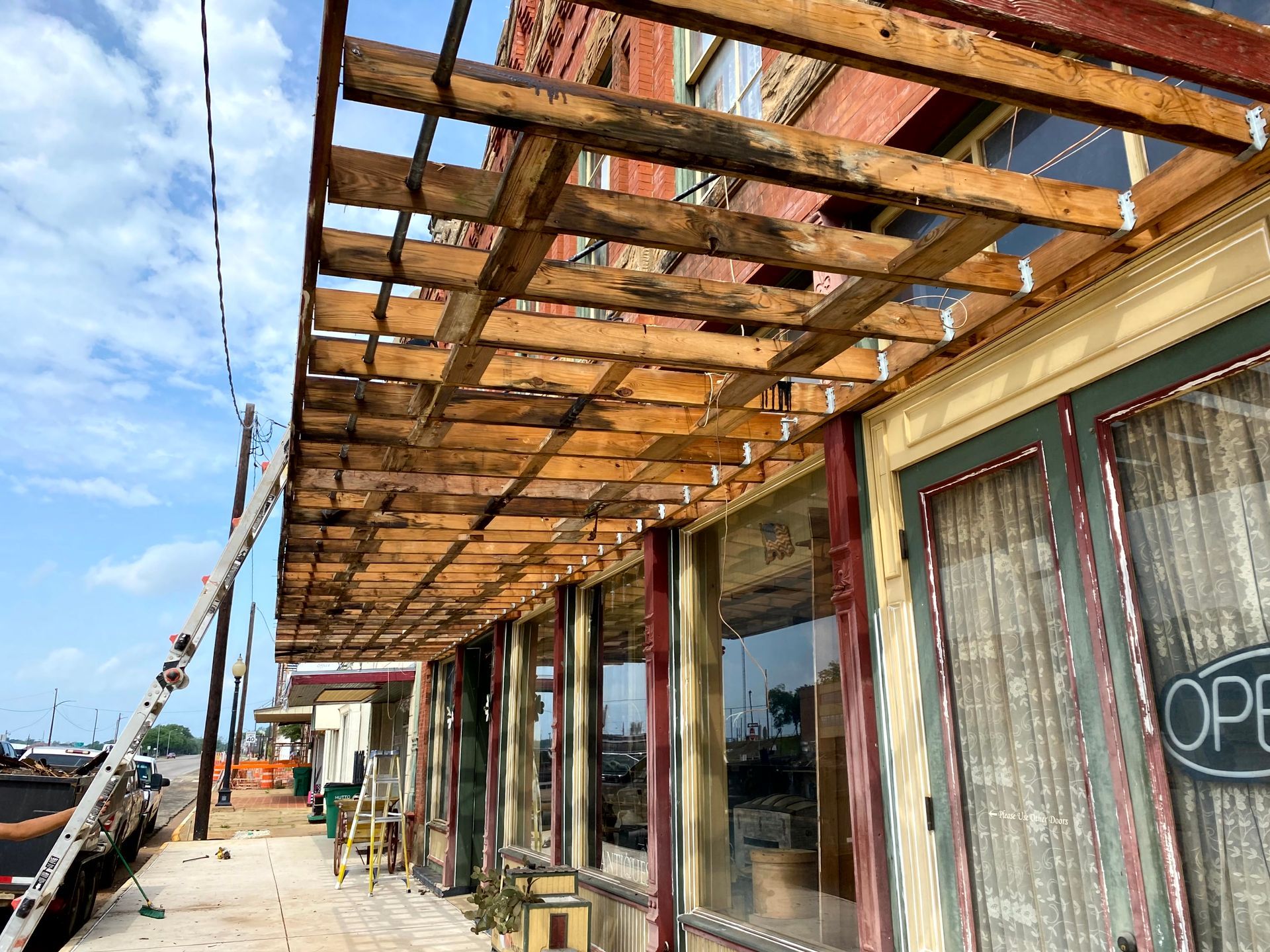 A wooden structure is being built on the side of a building.
