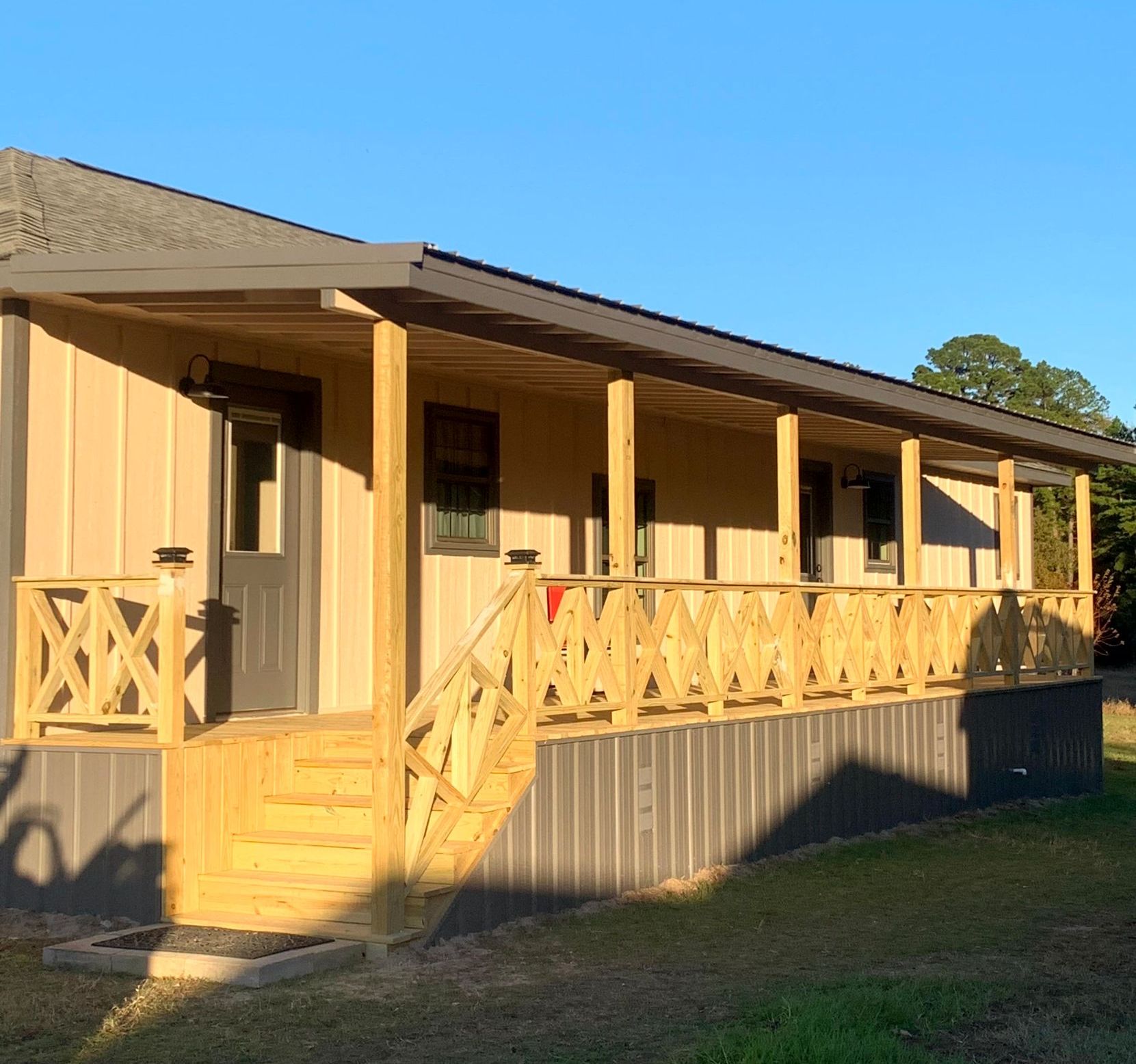 A house with a large porch and stair by home remodelers.