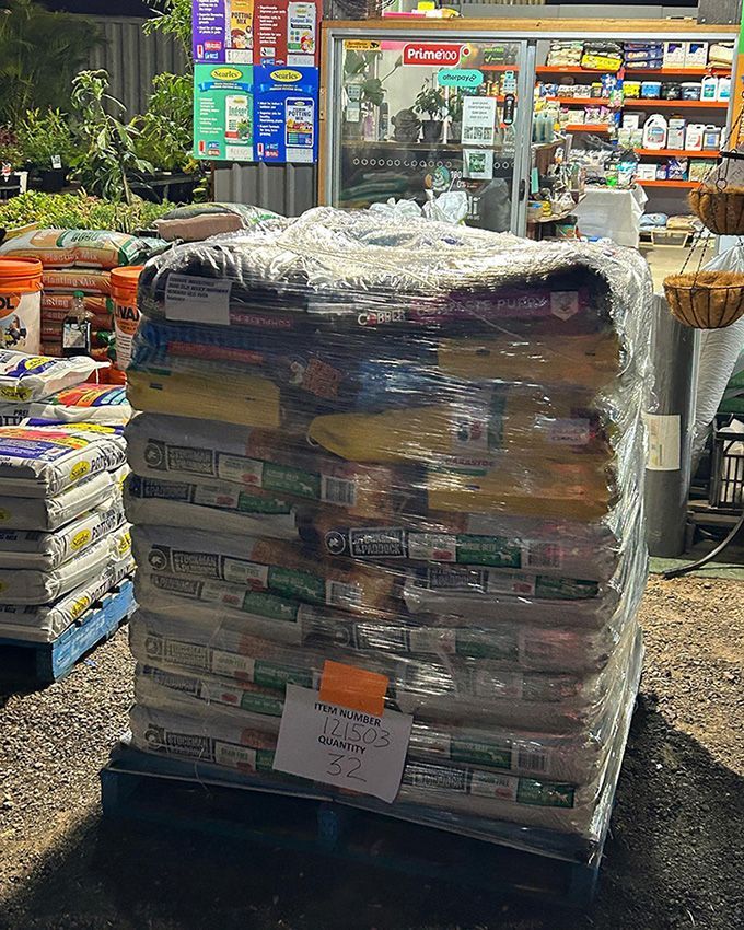 A Pallet Filled With Bags of Food — Howard Landscape and Produce Supplies in Howard, QLD
