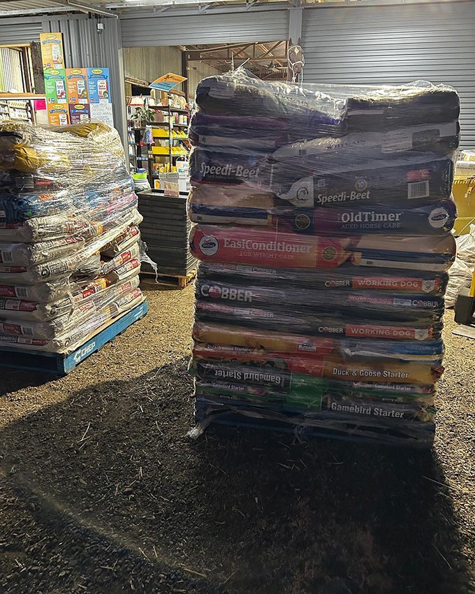 A Large Pile of Dog Food Stacked on Top of Each Other — Howard Landscape and Produce Supplies in Hervey Bay, QLD