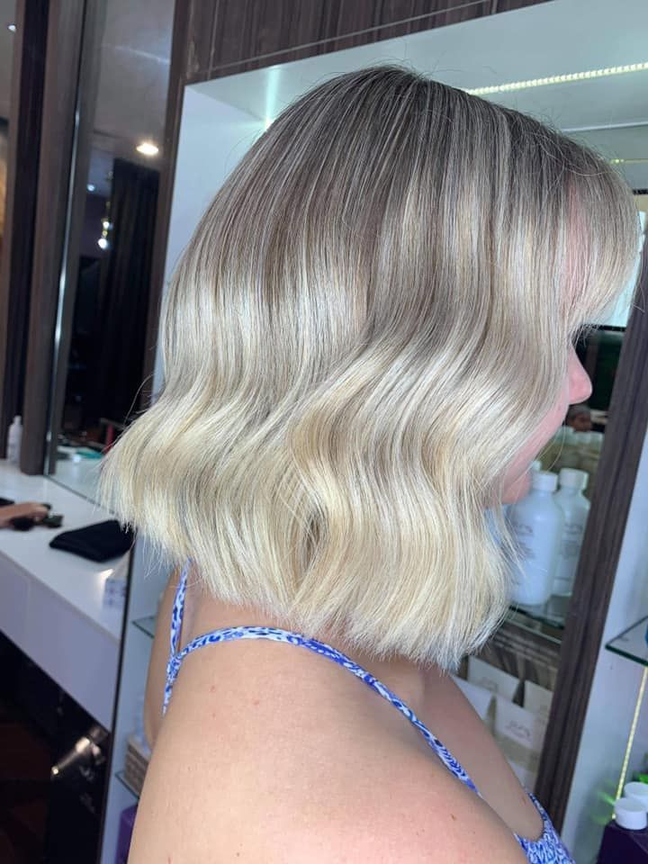 Blonde Woman With Wavy Bob Hairstyle, Wearing a Blue Patterned Tank Top — Studio 23 In Biggera Waters, QLD