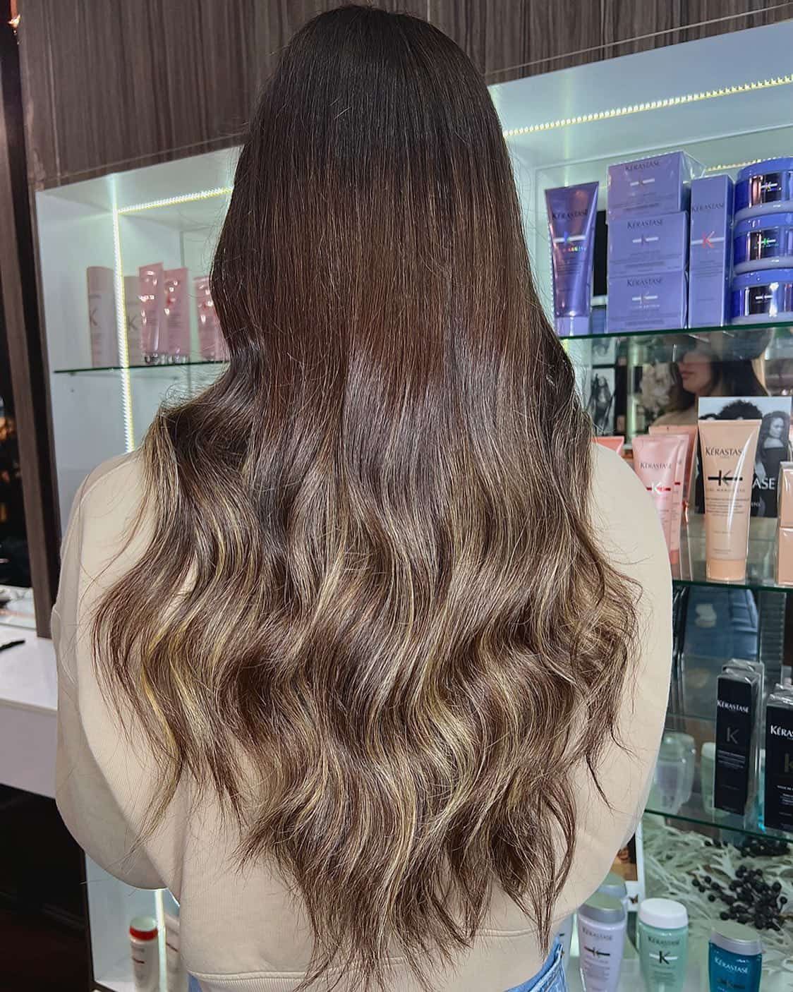 Woman With Long Brown Hair Styled With Waves in a Salon — Studio 23 In Biggera Waters, QLD