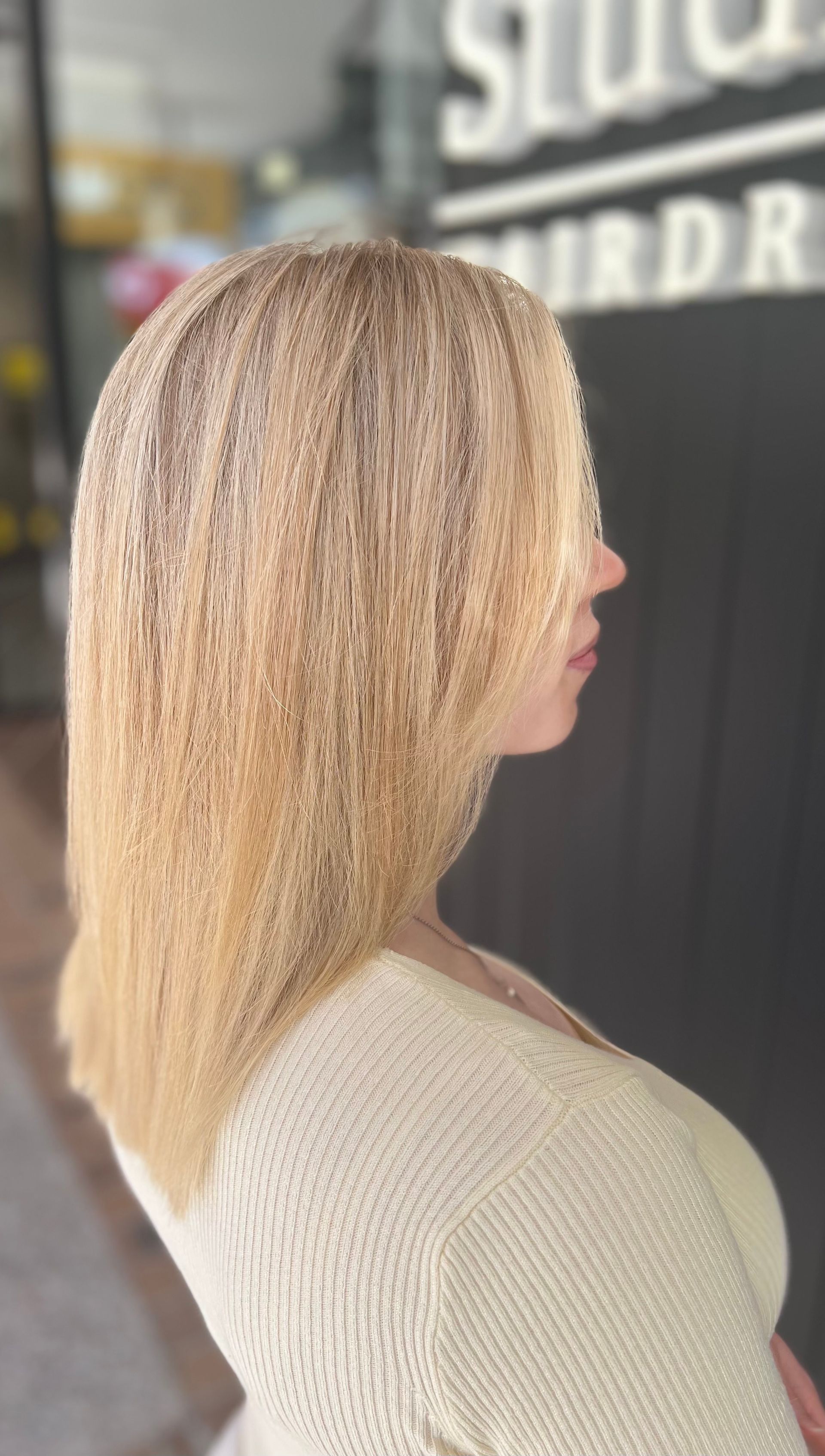Woman With Blonde Hair in a Salon, Profile View, With Light Colors and Plants — Studio 23 In Biggera Waters, QLD