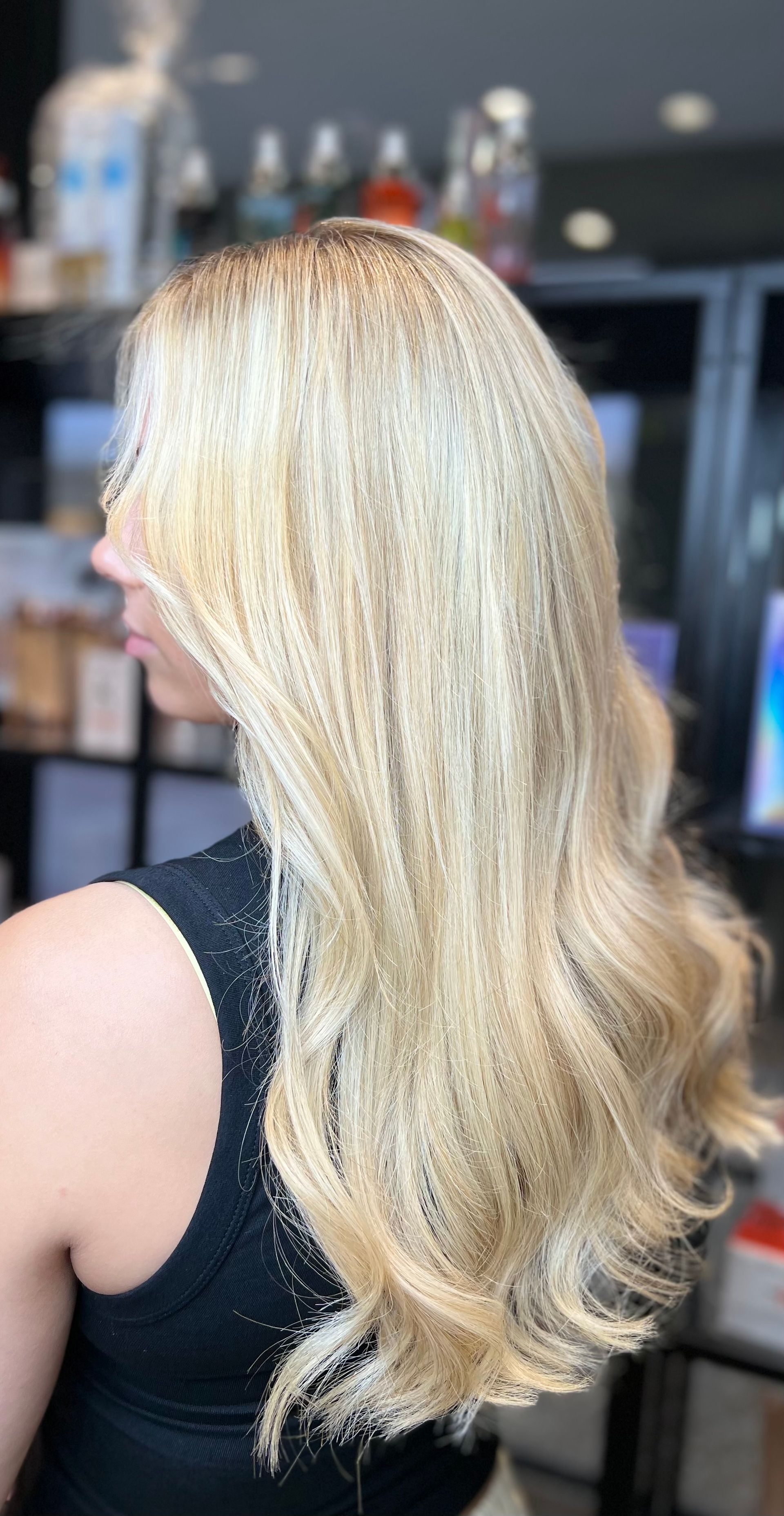 Woman With Blonde Hair Styled in Loose Curls — Studio 23 In Biggera Waters, QLD