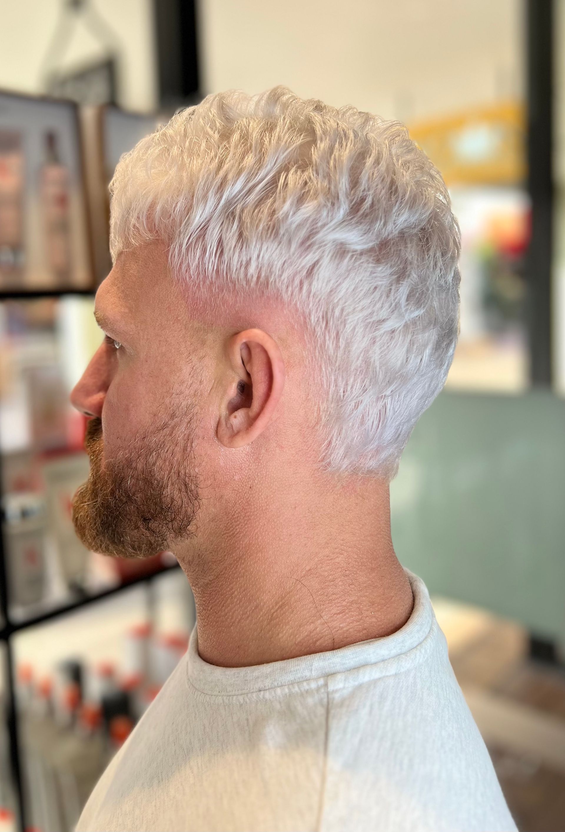 Man with short, white-blonde hair and faded beard. Wearing a white shirt, in a salon — Studio 23 In Biggera Waters, QLD
