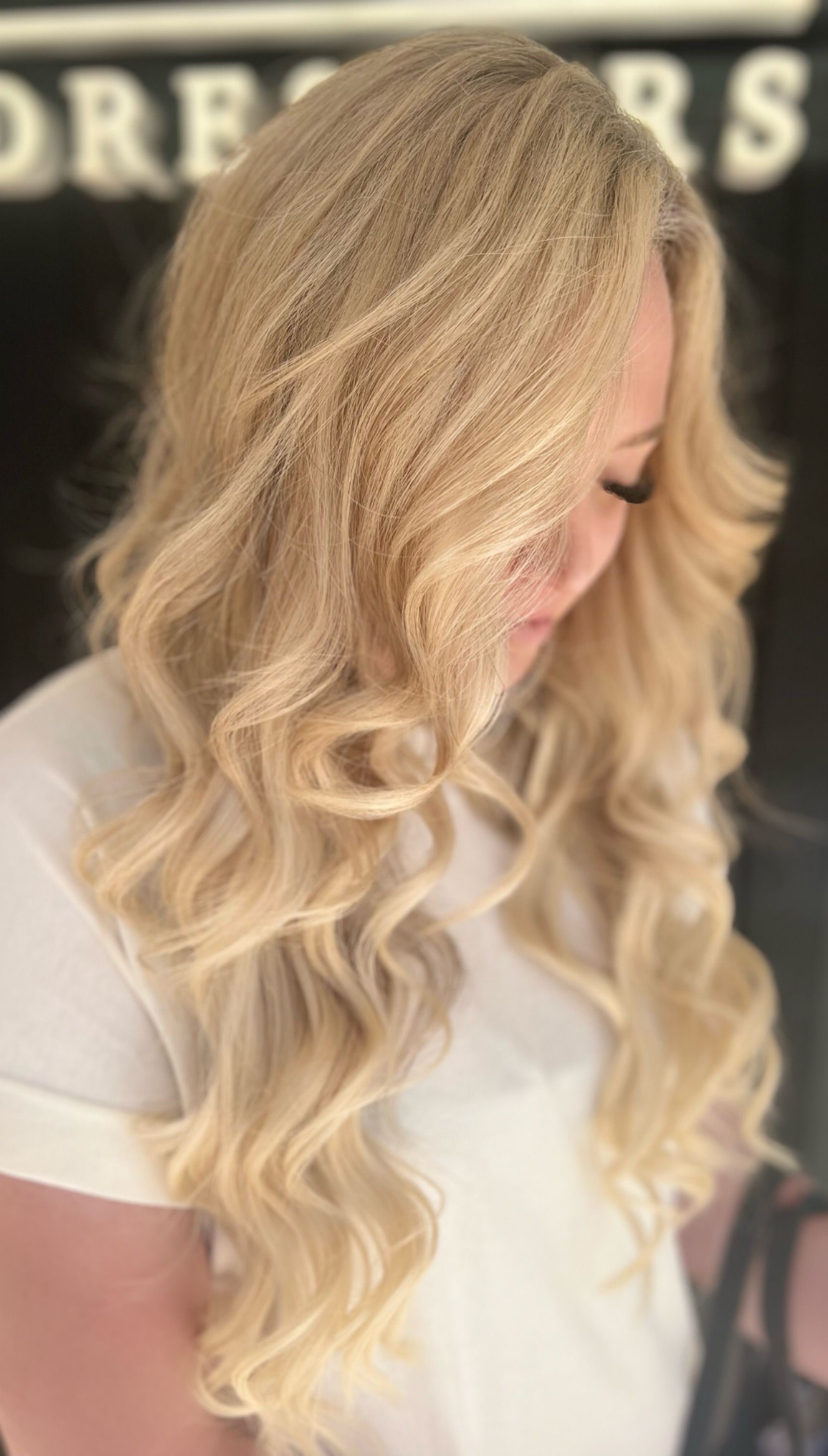 Woman With Long Black Hair, Red Highlights, in a Salon Setting — Studio 23 In Biggera Waters, QLD