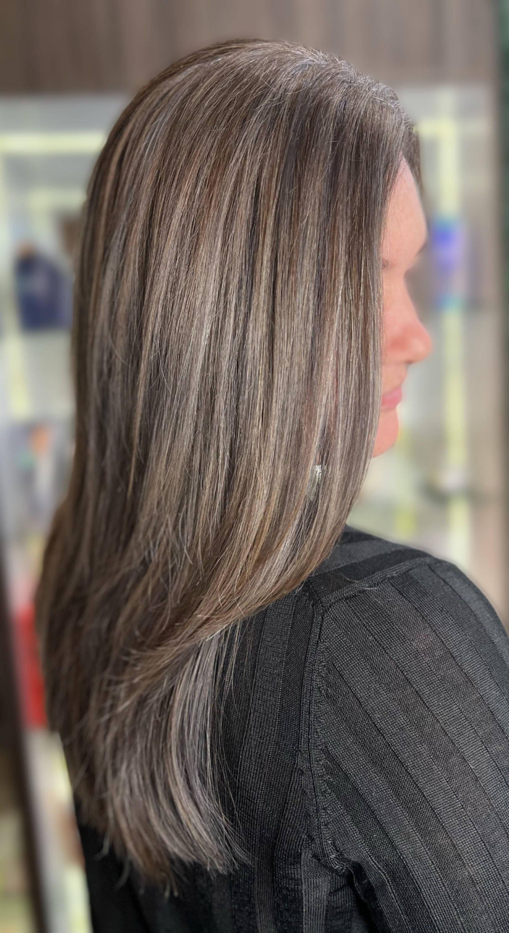 Woman With Wavy Brown Hair, Highlighted, in a Salon Setting — Studio 23 In Biggera Waters, QLD