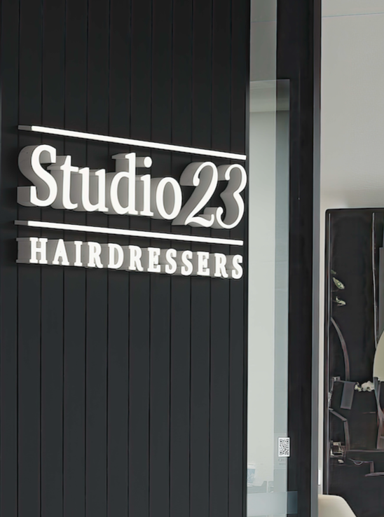Hair Salon Interior: Black Chairs, Mirrors, White Counter — Studio 23 In Biggera Waters, QLD
