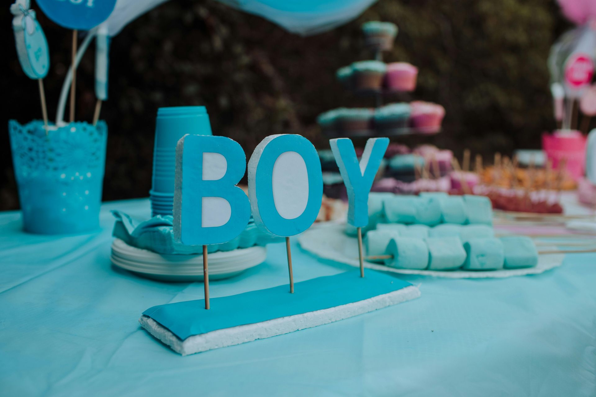 A table with a sign that says `` boy '' on it.