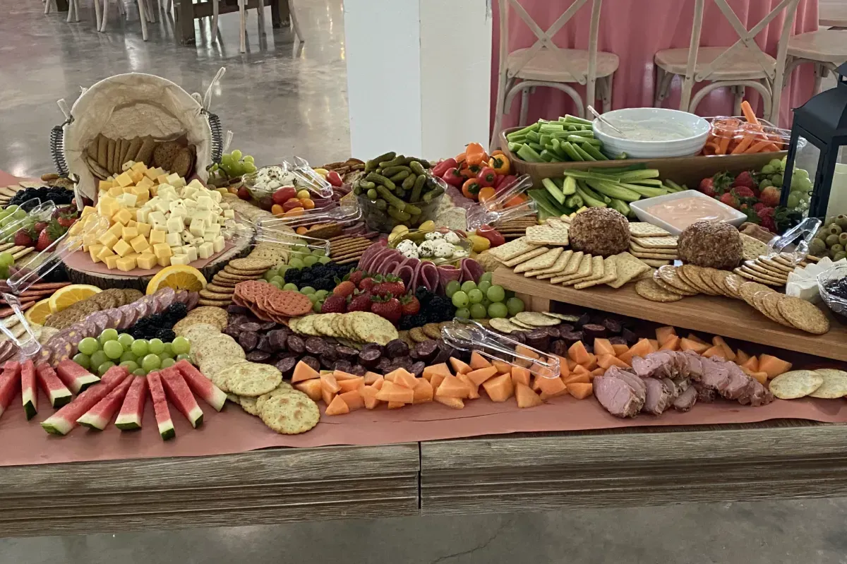 A large table topped with lots of food and vegetables.
