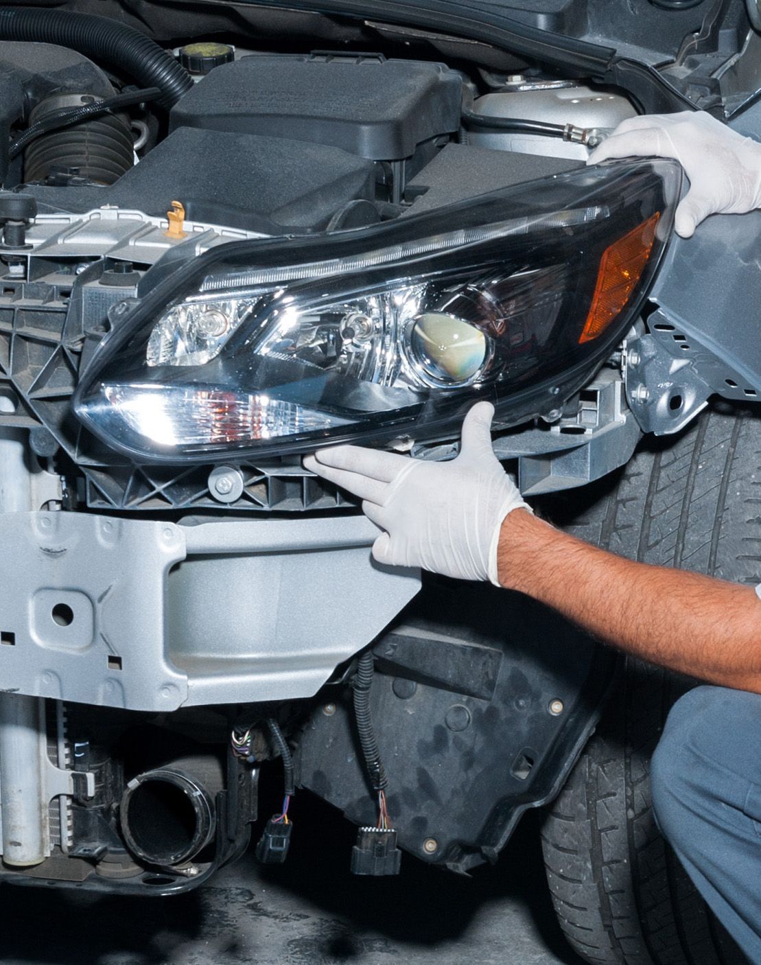 Front end collision repair, replacing a headlight.