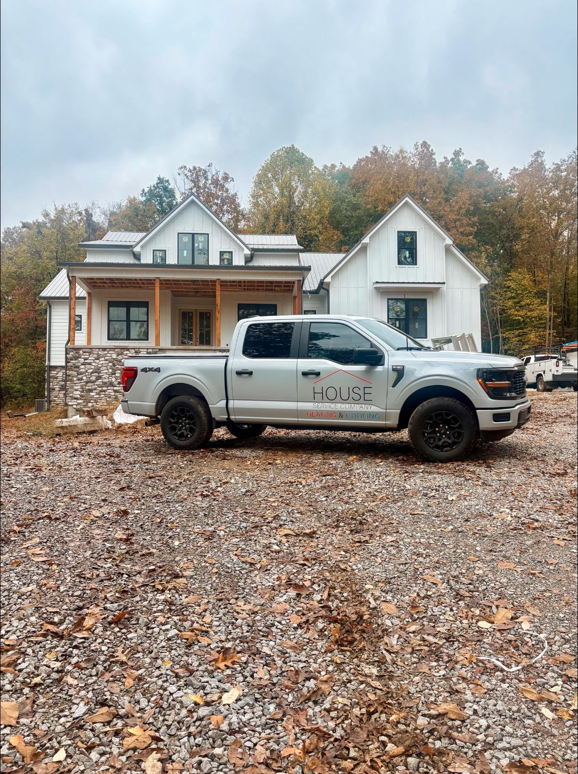 A room with a lot of pipes and aluminum foil on the ceiling.